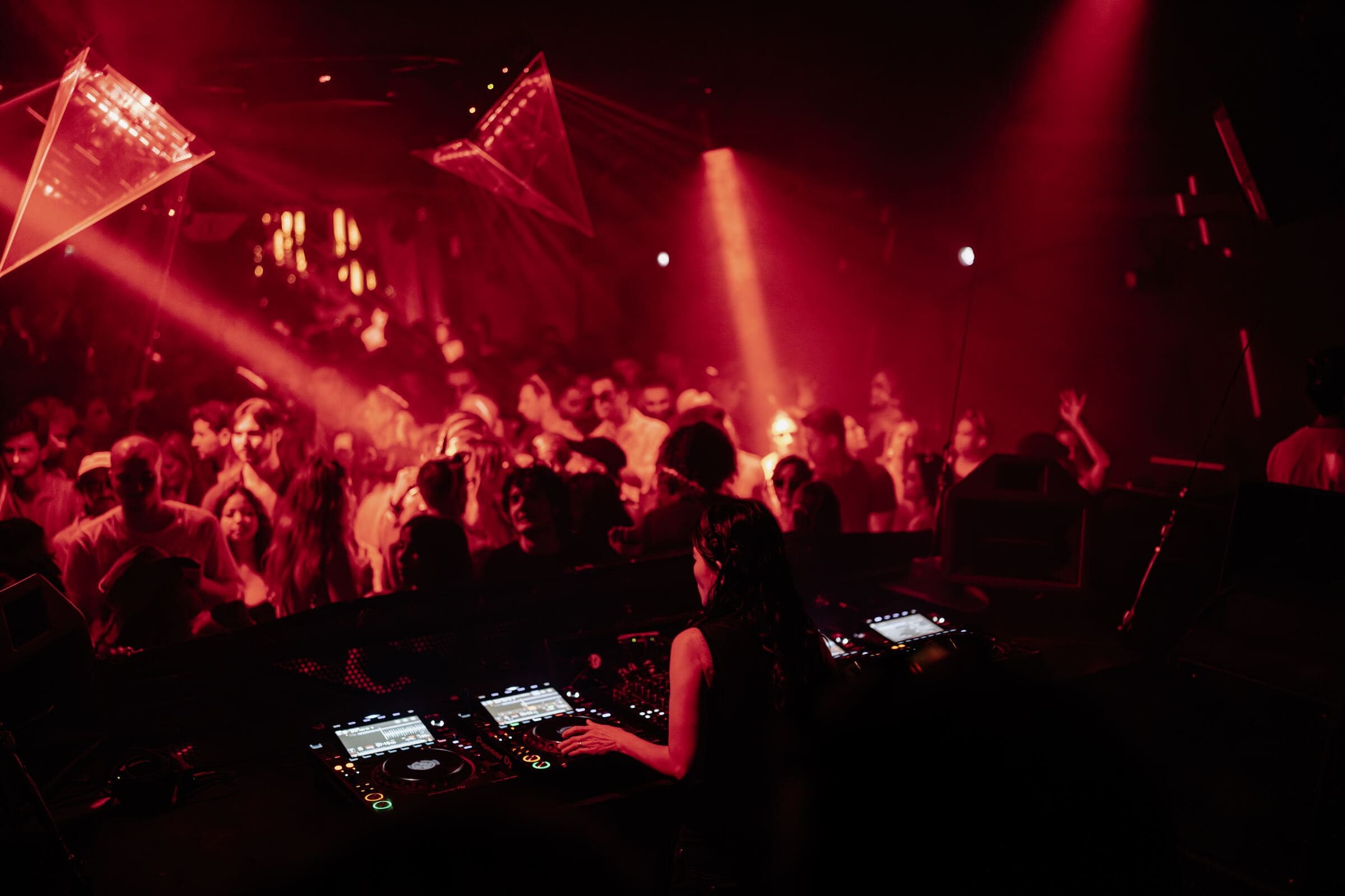 DJ playing to the S.A.S.H crowd under red light