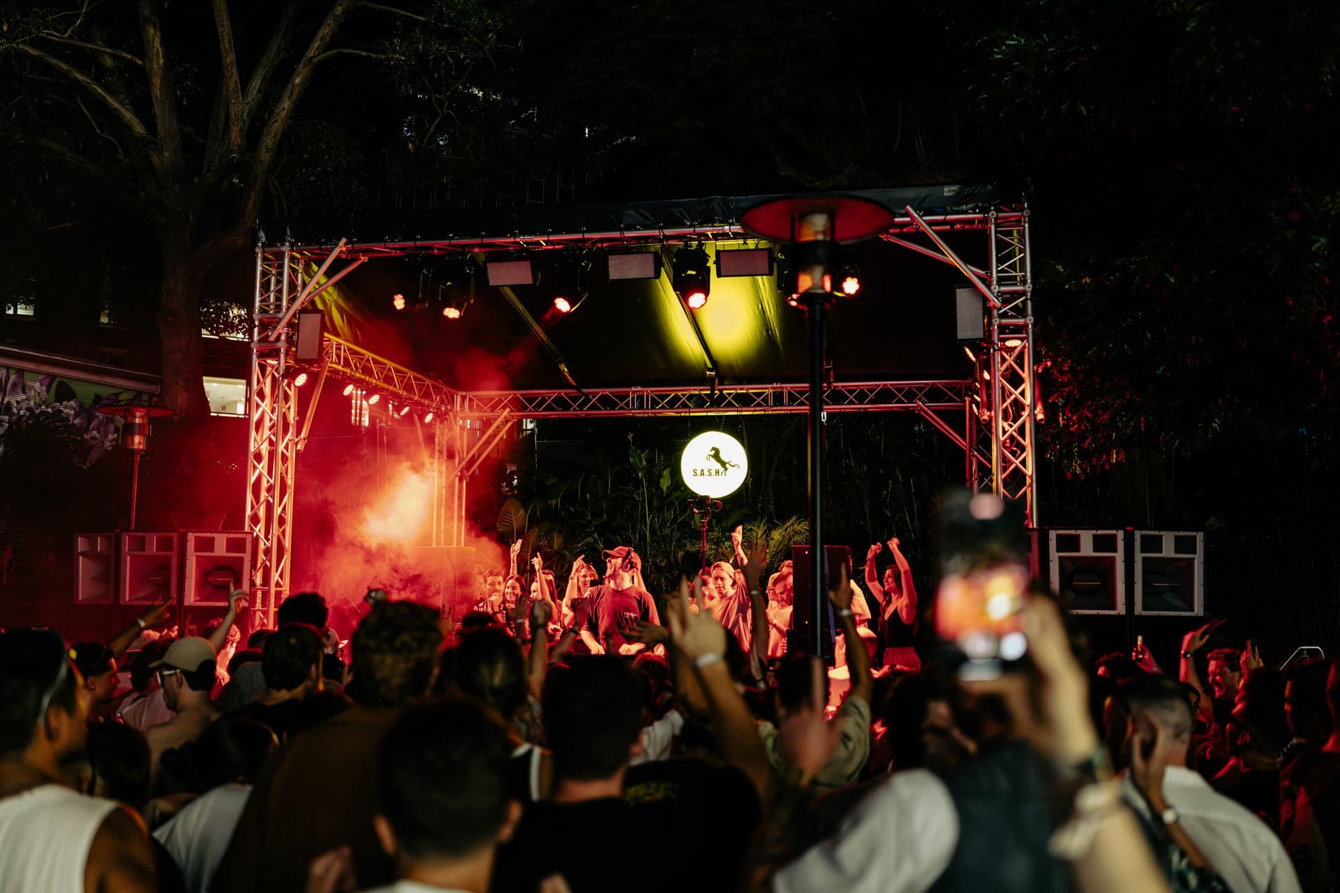 Outdoor S.A.S.H stage with smoke and a packed dancefloor